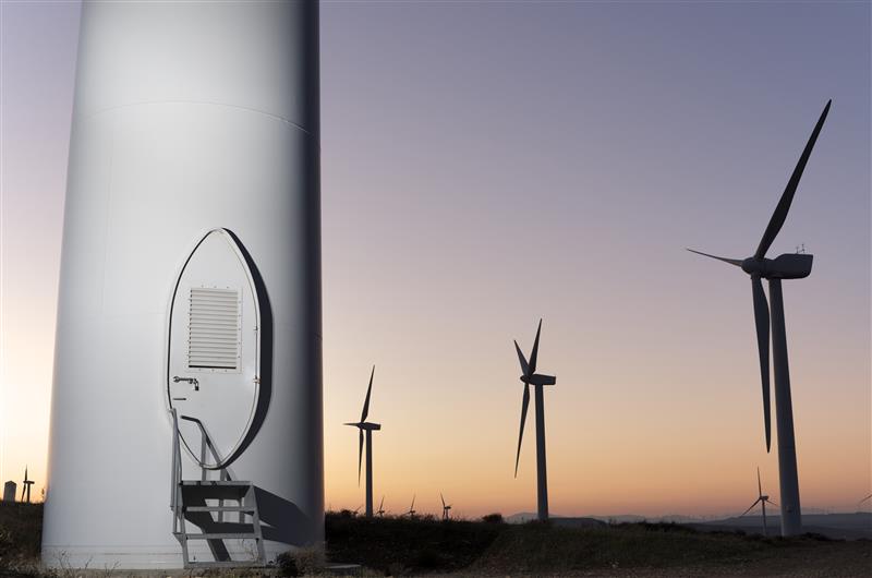 Fleet solutions for utilities - image of windmills in the sunset