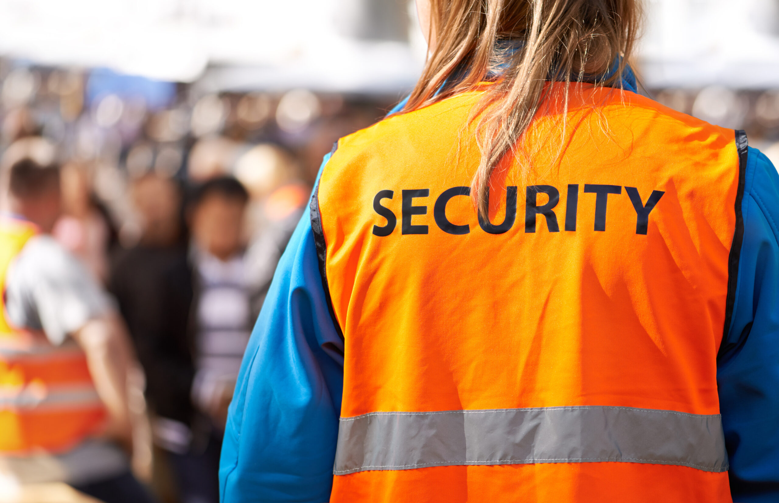 Business van rental solutions for integrated FM - image shows a security guard on crowd control